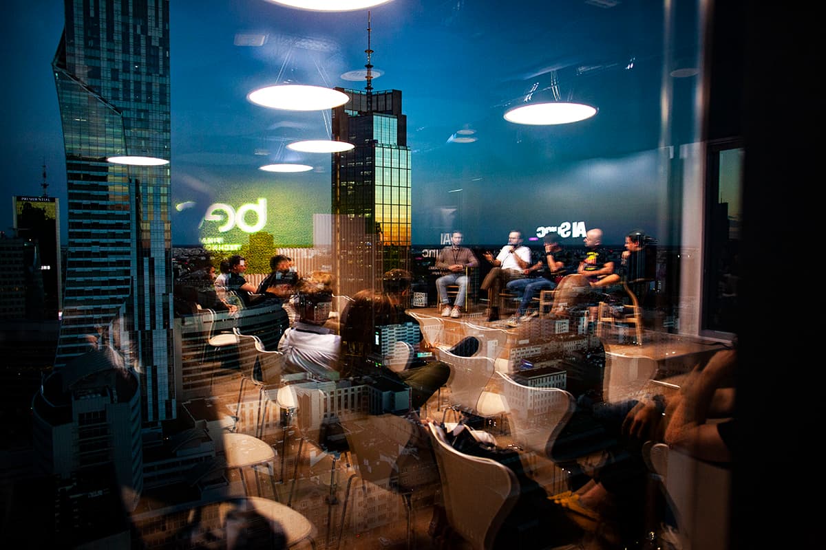 Panel seen through glass reflecting the skyline