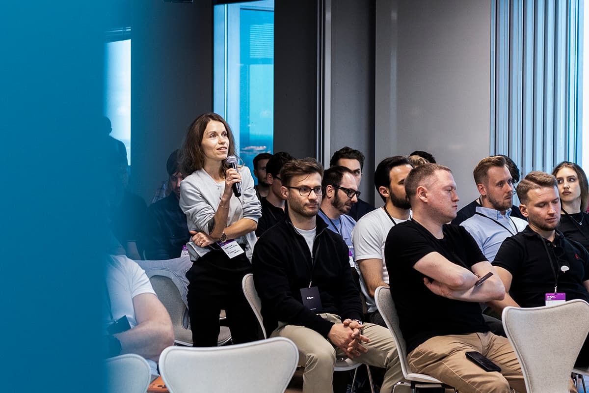 Attendee asking a question into a microphone
